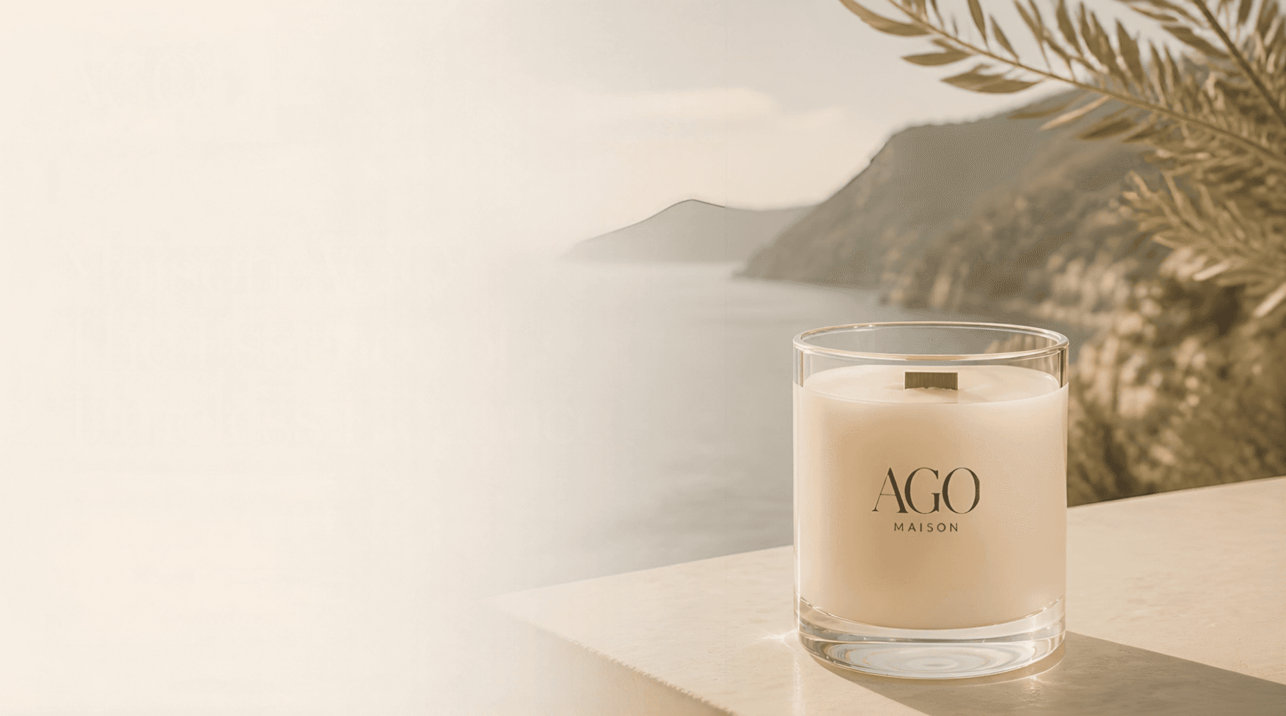 AGO MAISON white candle in a glass jar overlooking a blurred, sunlit coastal bay landscape.